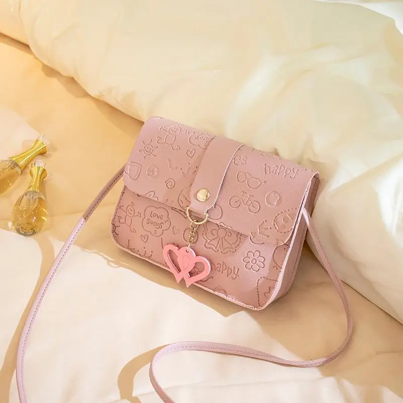 Pink Embossed Ladies Shoulder Bag with Heart Pendant - Image 4