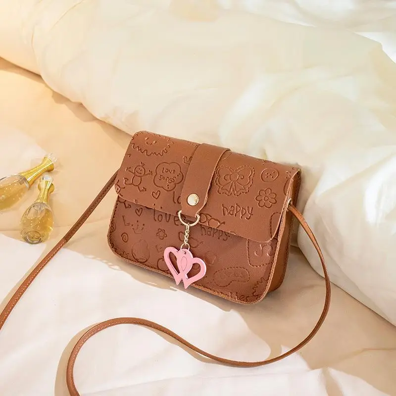 Pink Embossed Ladies Shoulder Bag with Heart Pendant - Image 5