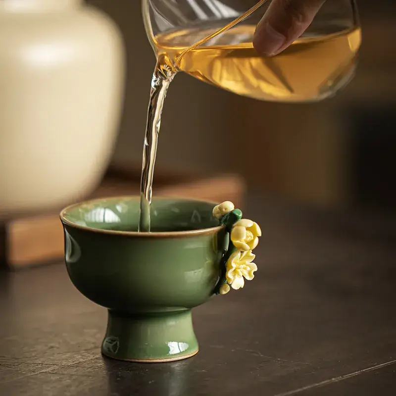 Green Handmade Ceramic Tea Cup with Flower Design - Image 3