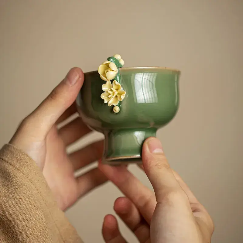 Green Handmade Ceramic Tea Cup with Flower Design - Image 4