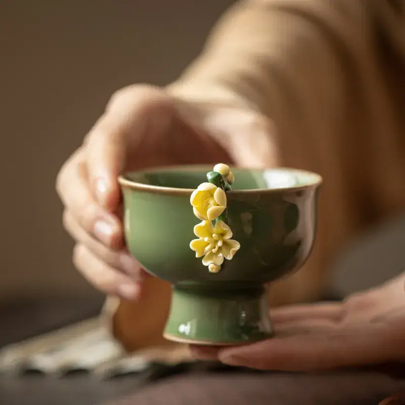 Green Handmade Ceramic Tea Cup with Flower Design - Image 5