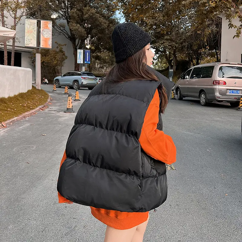 Women's Black Puffer Vest with Orange Sleeves Large