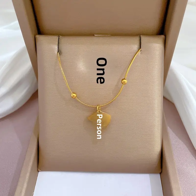 Gold Pendant Necklace with Black Circle Design - Image 8