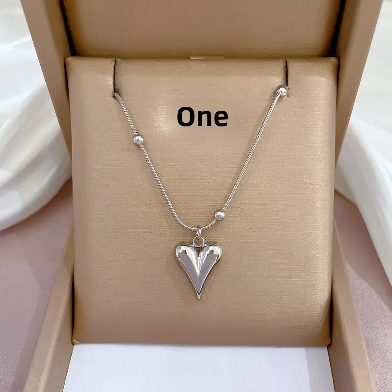 Gold Pendant Necklace with Black Circle Design - Image 9