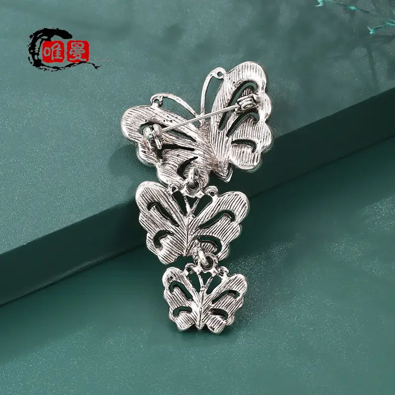 Vintage Silver Butterfly Brooch with Blue Crystal Diamonds - Image 6