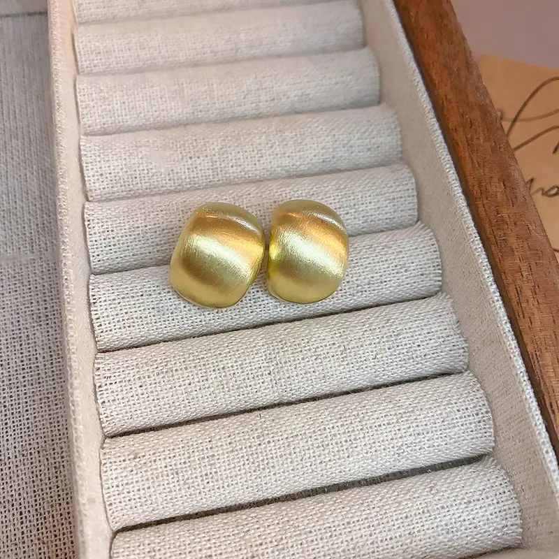 Gold-silver C- shaped brushed earrings