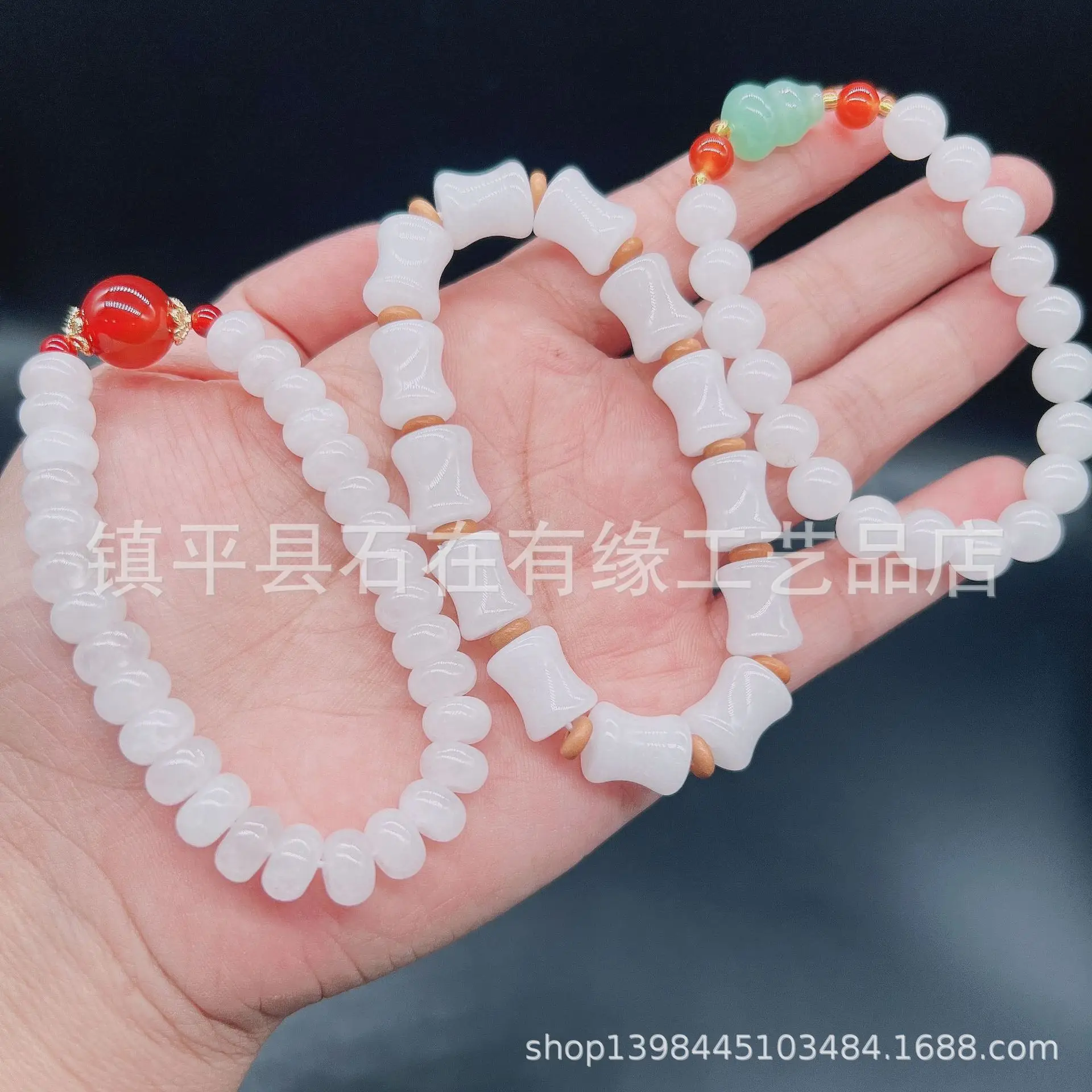 Xinjiang Golden Silk White Jade Round Bead Bracelet — feature 1