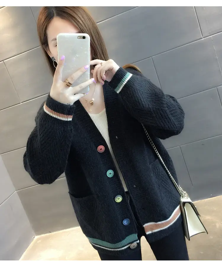 Model wearing the black cardigan, shown from the front.