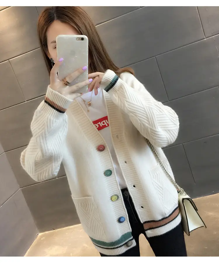Front view of white cardigan with V-neck, multicoloured buttons and two patch pockets.