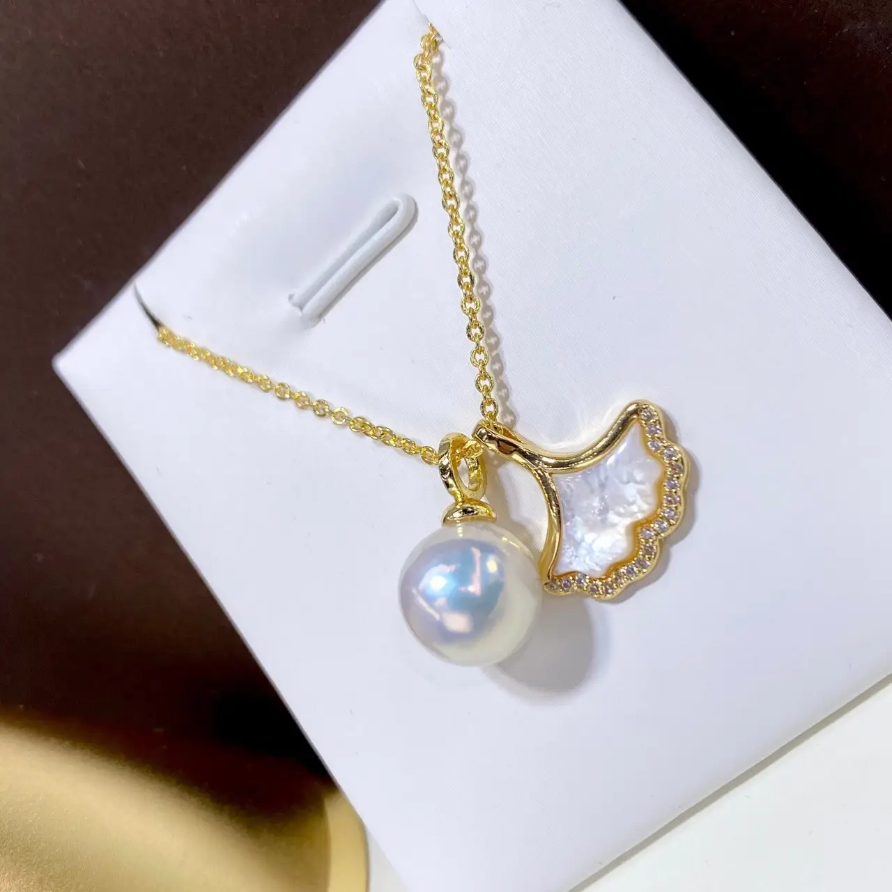 Gold Pearl Crossbody Necklace with Mother Shell Design - Image 4