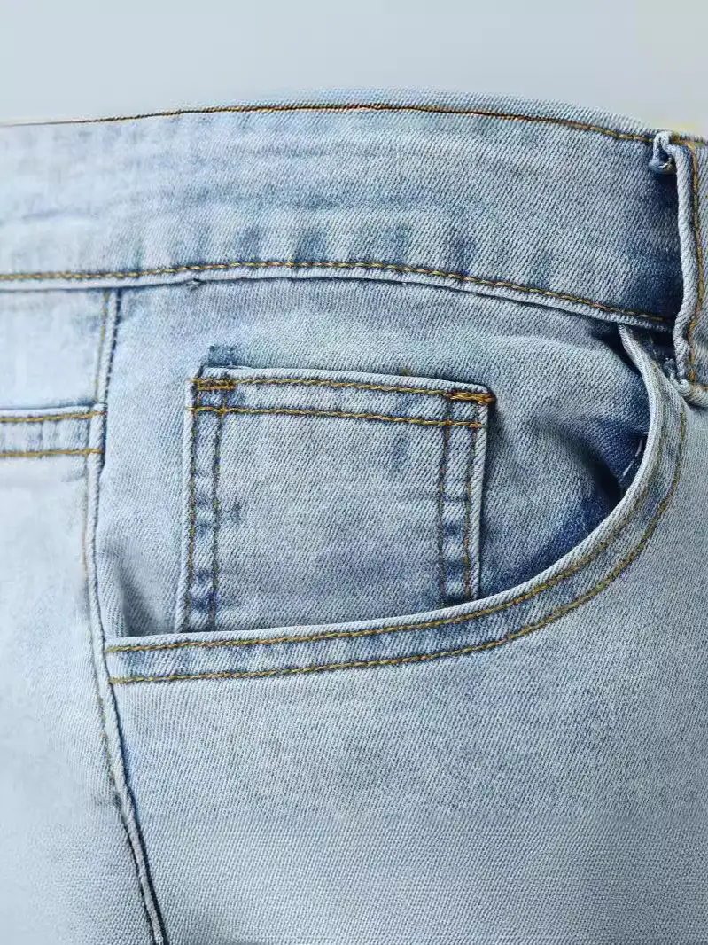 Washed Light Blue Jeans for Men with Holes & White Sneakers - Image 3