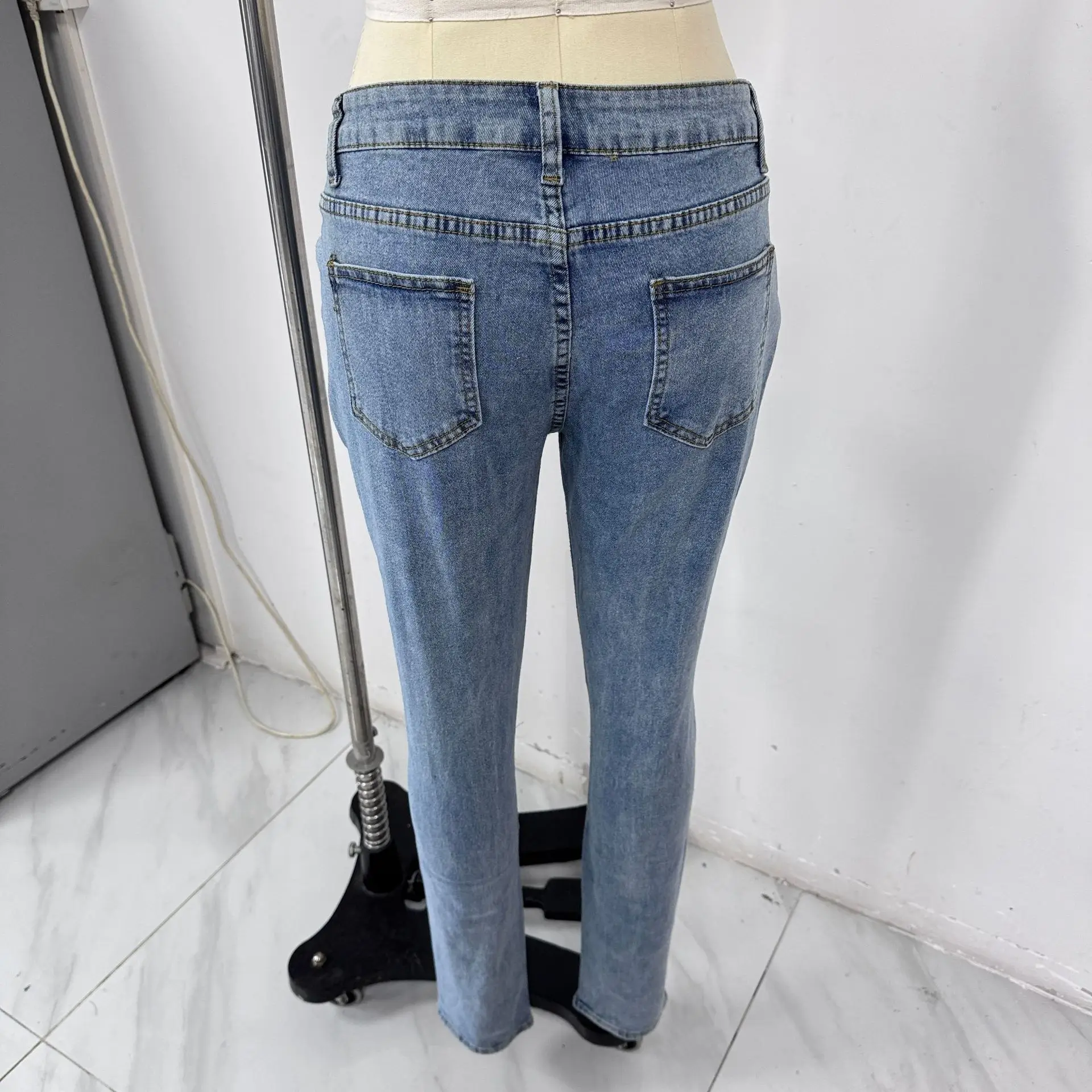 Washed Light Blue Jeans for Men with Holes & White Sneakers — feature 5