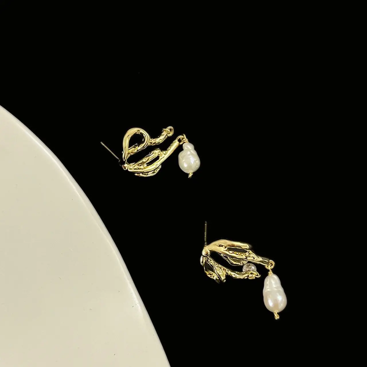 Abstract Melted Bow Pearl Earrings Silver Pin — feature 7