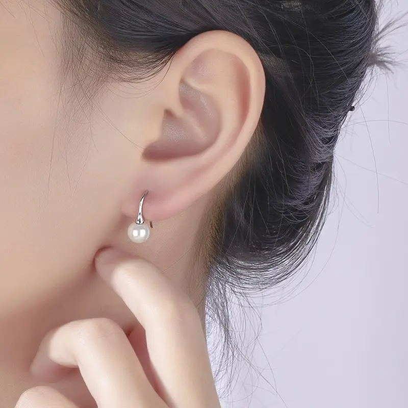 Women's Pearl Drop Earrings with Star Design