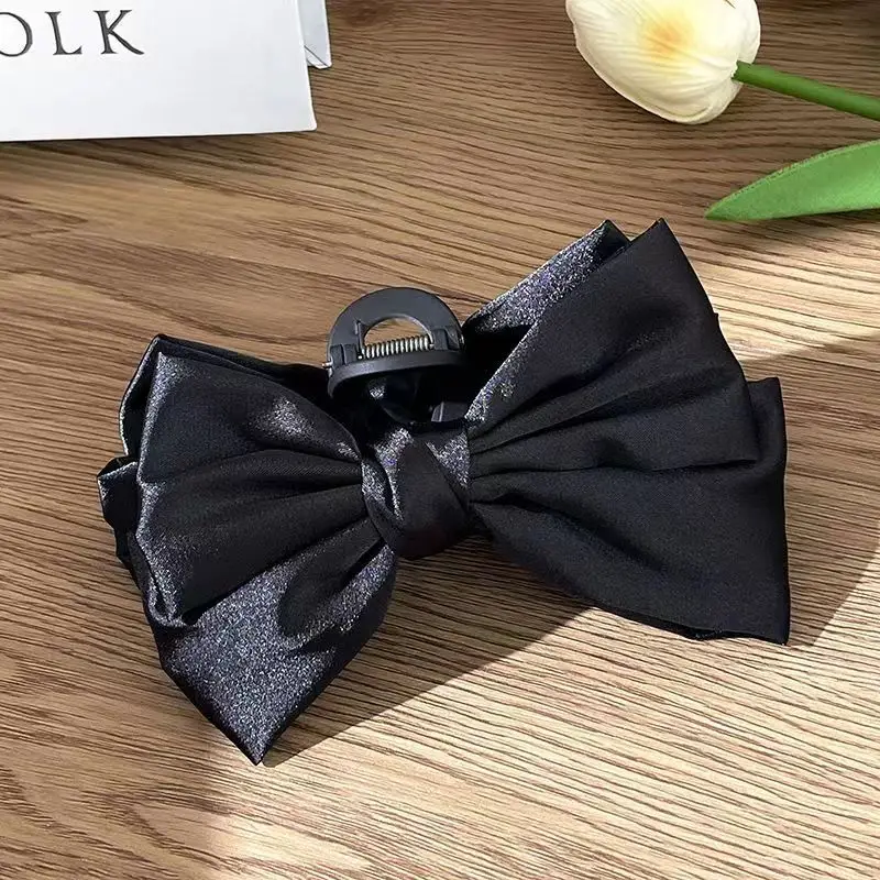 Black double-sided bow grip clip
