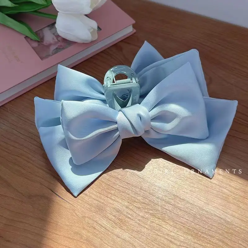 Blue double-sided bow grip clip