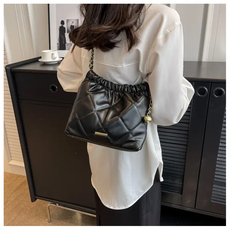 Black Quilted Shoulder Bag with Gold Chain Strap — feature 11