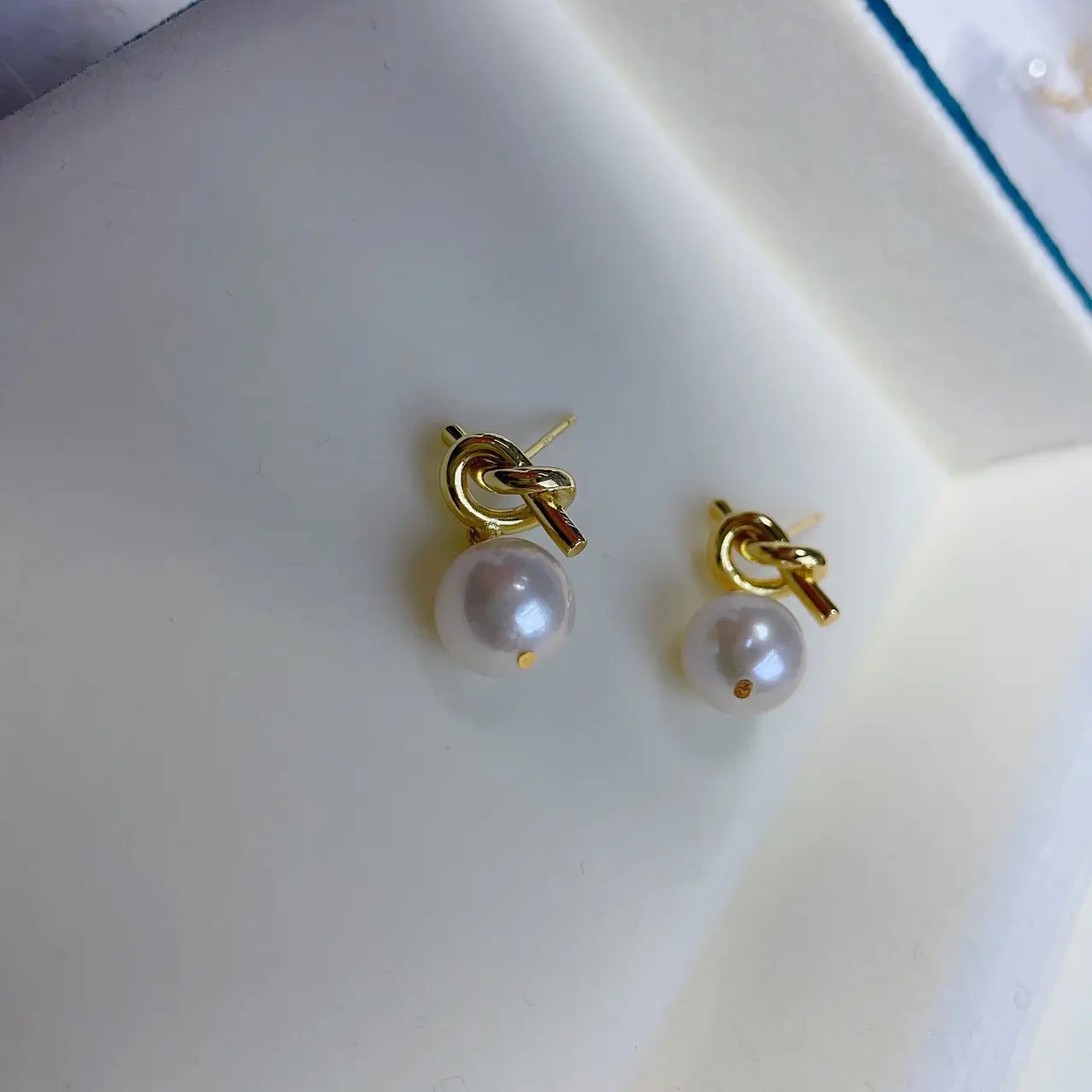 Artificial Pearl Earrings with Knoted Metal Design - Image 2