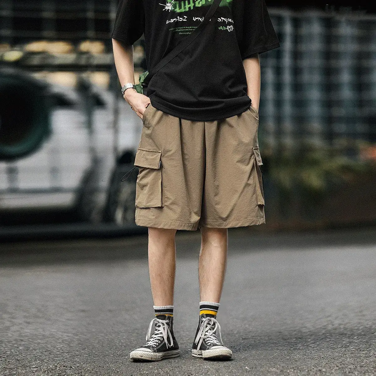 Men's Black Graphic Shorts with Cap and Sneakers - Image 4