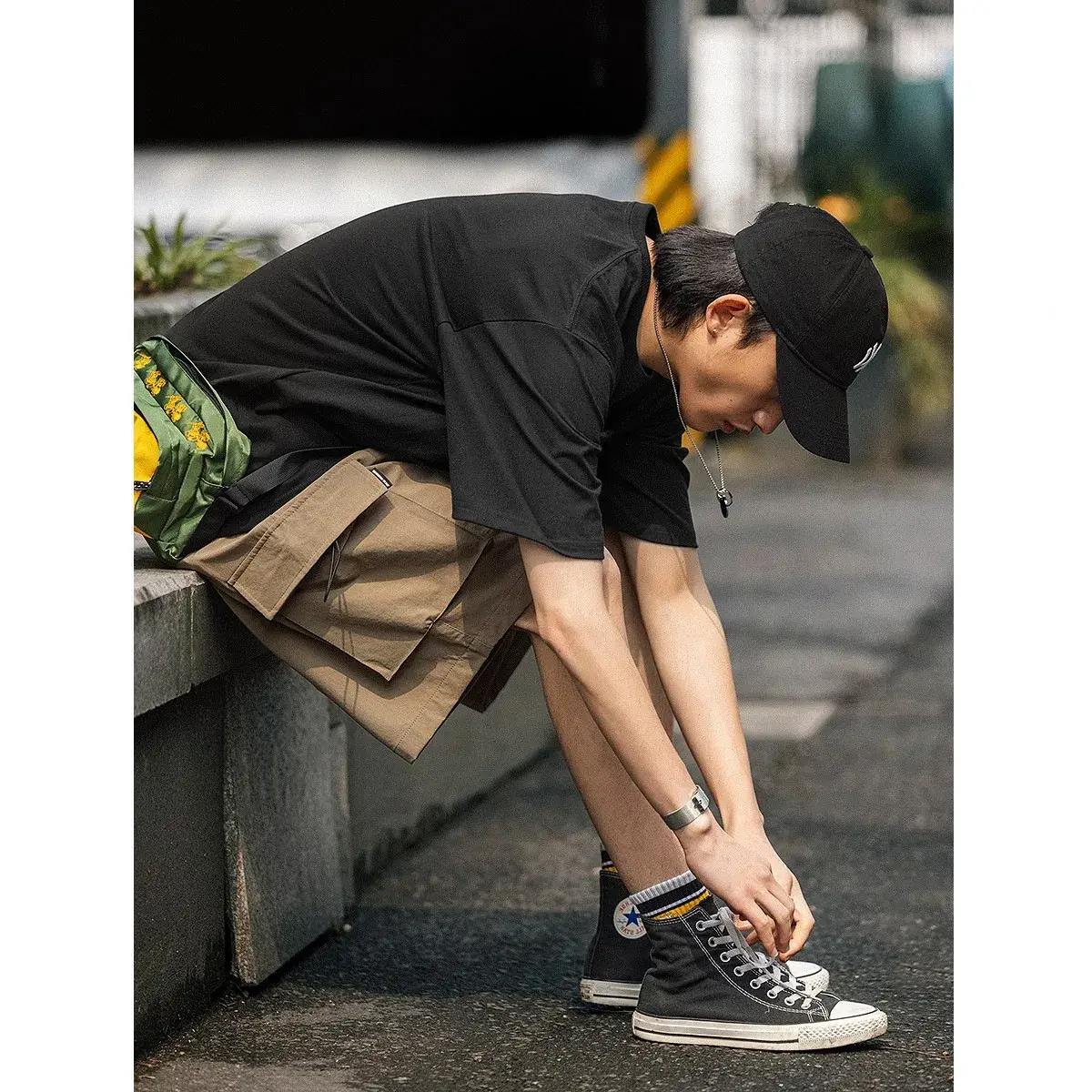 Men's Black Graphic Shorts with Cap and Sneakers - Image 6