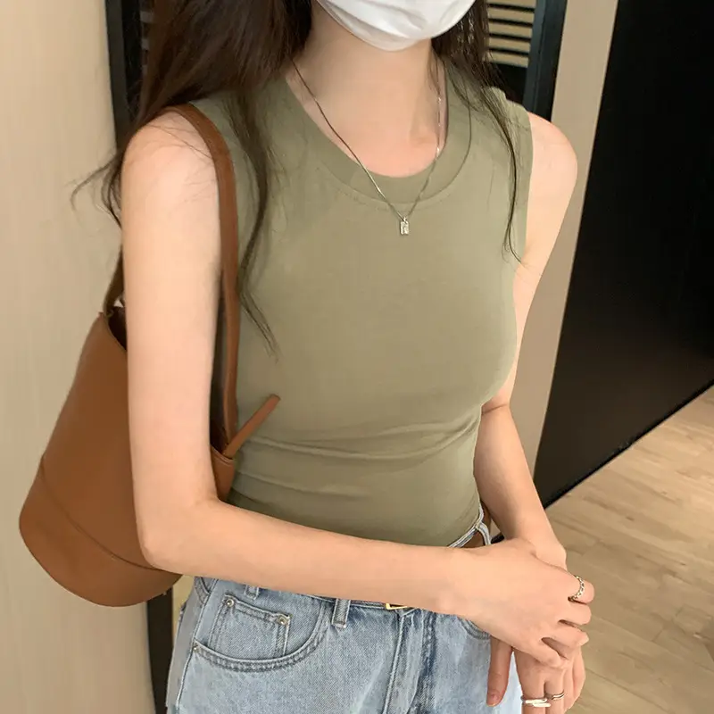 Black Sleeveless Top with Gold Necklace & Black Handbag - Image 5