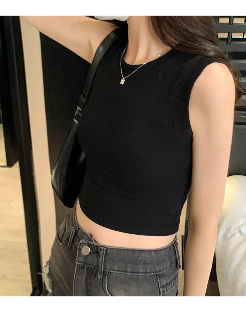 Black Sleeveless Top with Gold Necklace & Black Handbag — feature 20