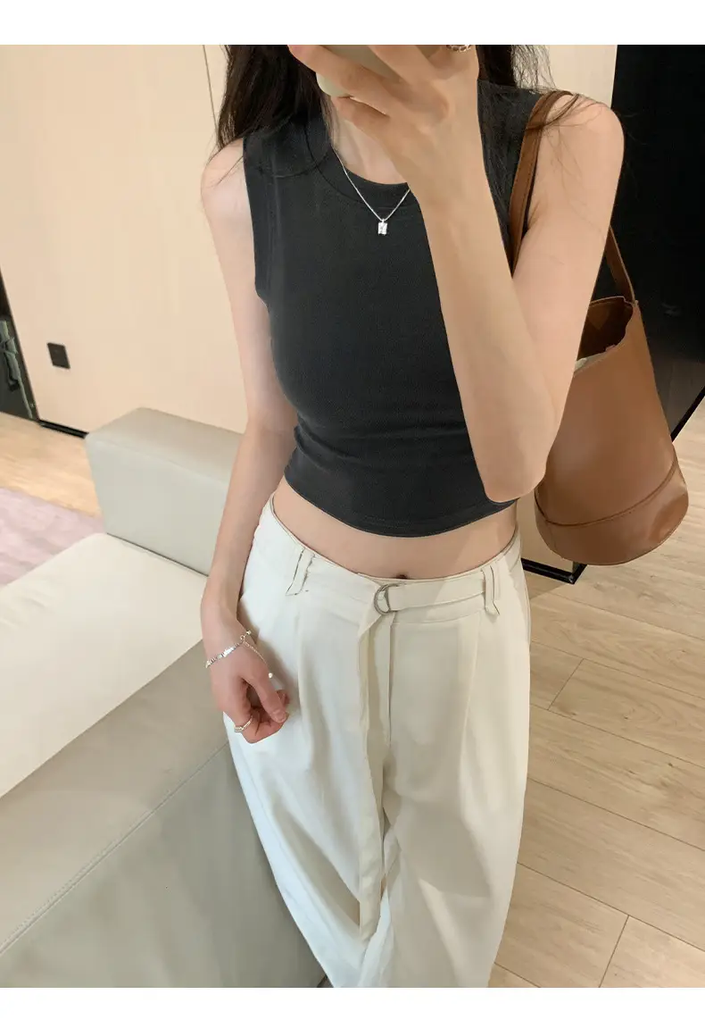 Black Sleeveless Top with Gold Necklace & Black Handbag — feature 22
