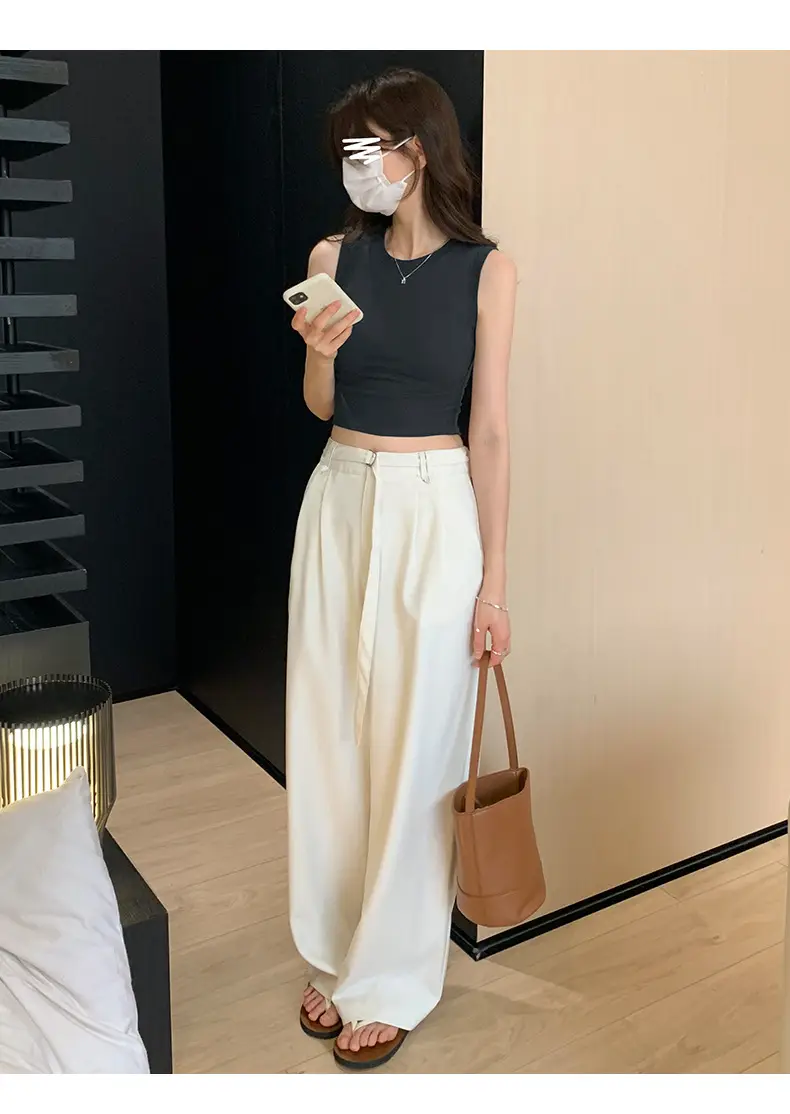 Black Sleeveless Top with Gold Necklace & Black Handbag — feature 24