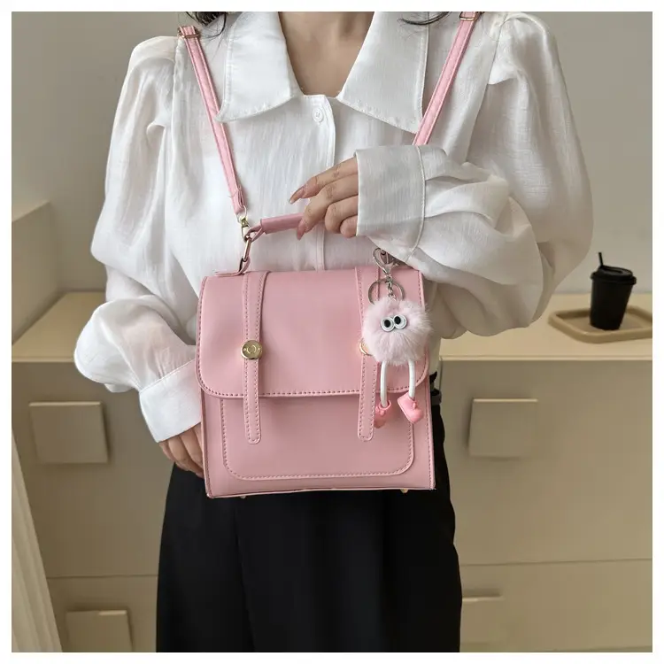 Women's Black Shoulder Backpack with Pom Pom Charm — feature 12