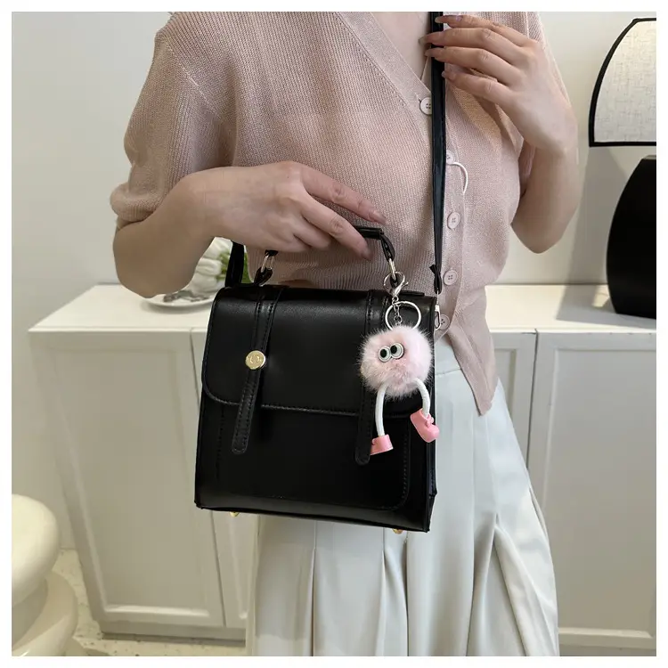 Women's Black Shoulder Backpack with Pom Pom Charm — feature 17