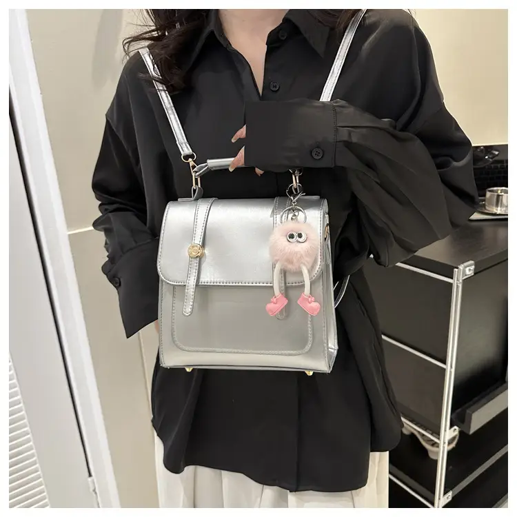 Women's Black Shoulder Backpack with Pom Pom Charm — feature 19