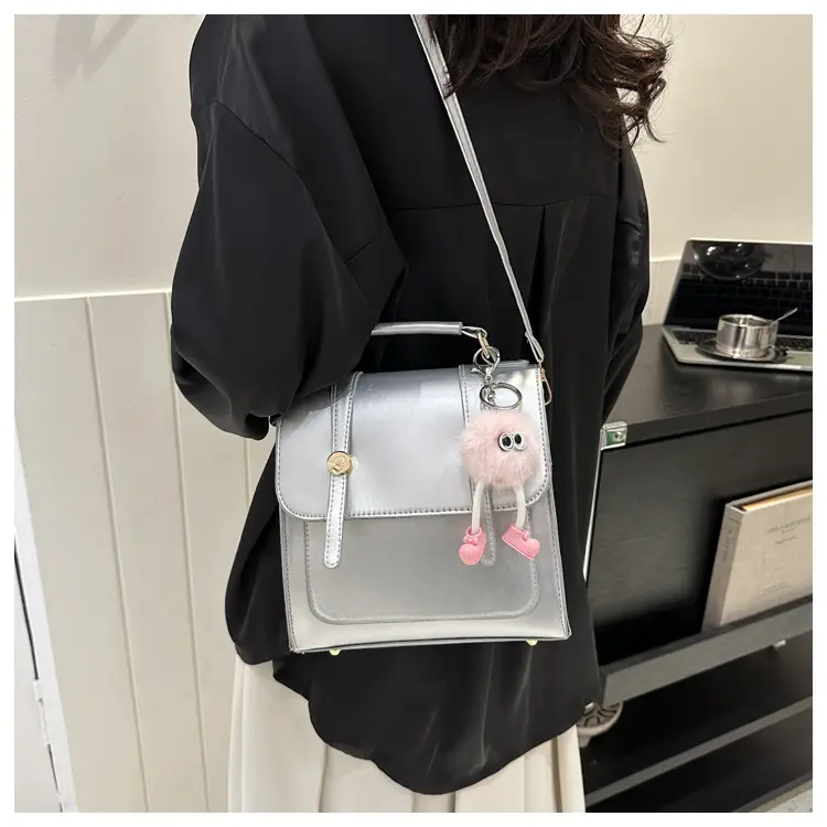 Women's Black Shoulder Backpack with Pom Pom Charm — feature 21