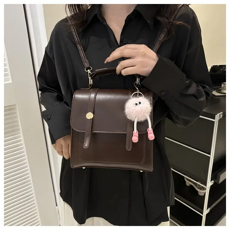 Women's Black Shoulder Backpack with Pom Pom Charm — feature 23