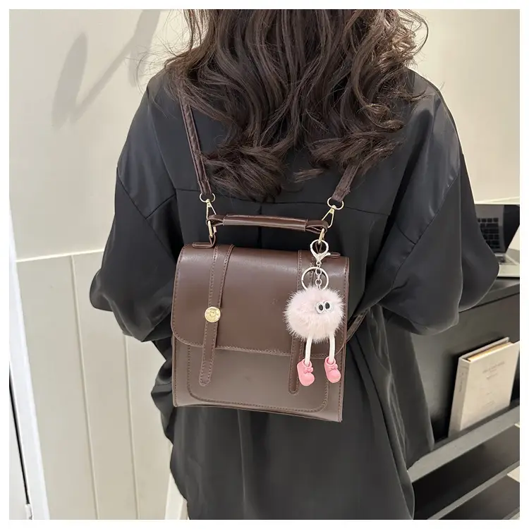 Women's Black Shoulder Backpack with Pom Pom Charm — feature 24