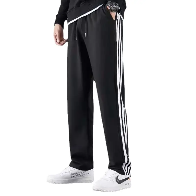 Men's Black Striped Track Pants with White Sneakers - Image 6