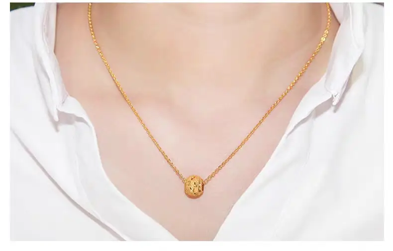 Water Shell Gold Necklace with Joker O Design — feature 9