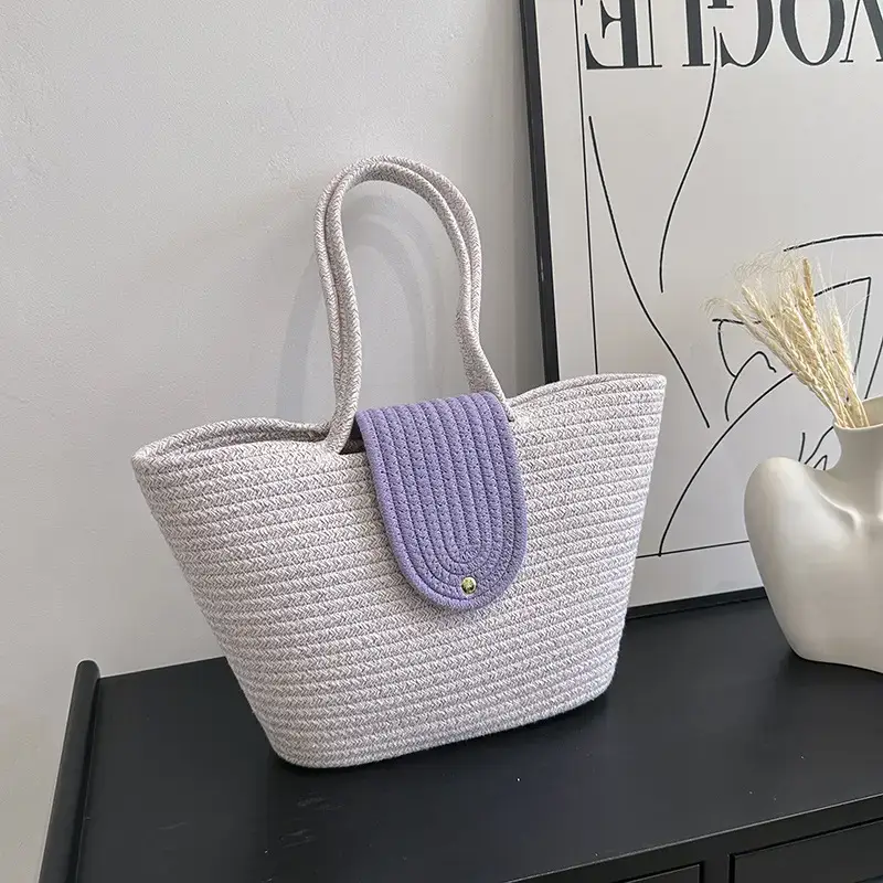 Women's woven straw tote bag with purple accent