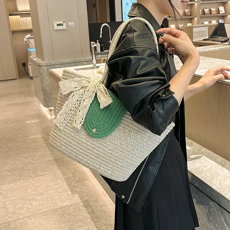 Women's woven straw tote bag with purple accent