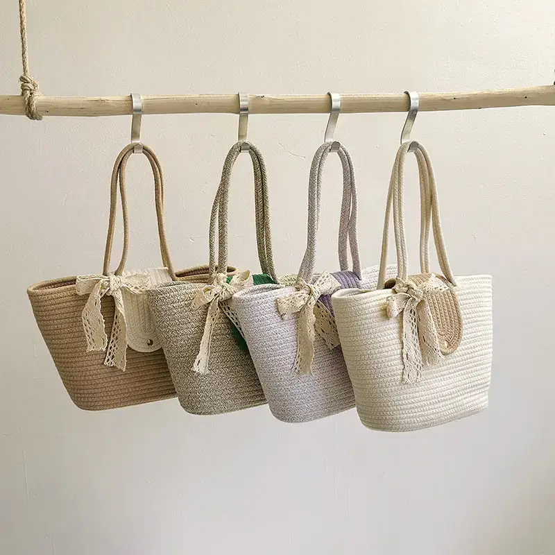 Women's woven straw tote bag with purple accent