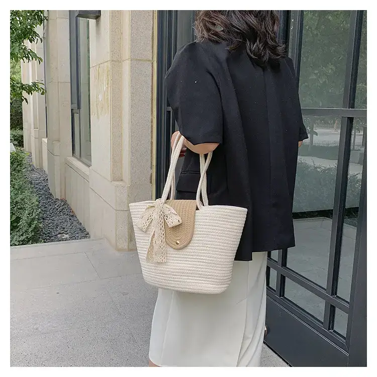Women's woven straw tote bag with purple accent — feature 15