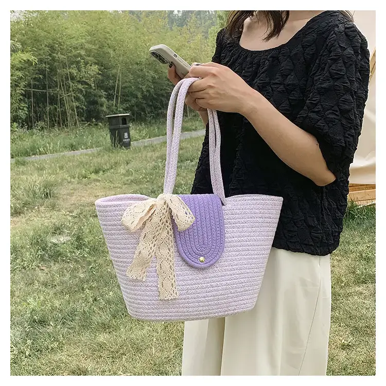 Women's woven straw tote bag with purple accent — feature 17