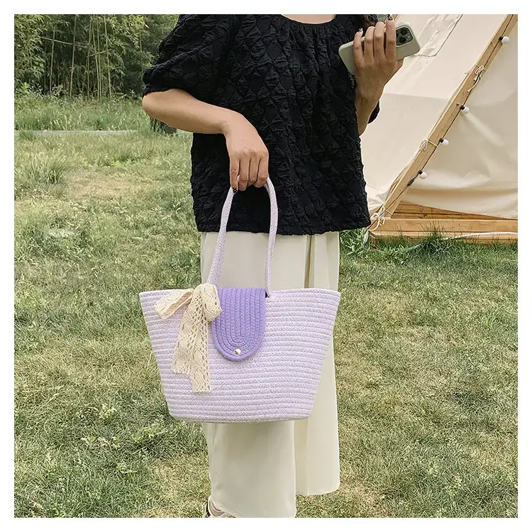 Women's woven straw tote bag with purple accent — feature 18