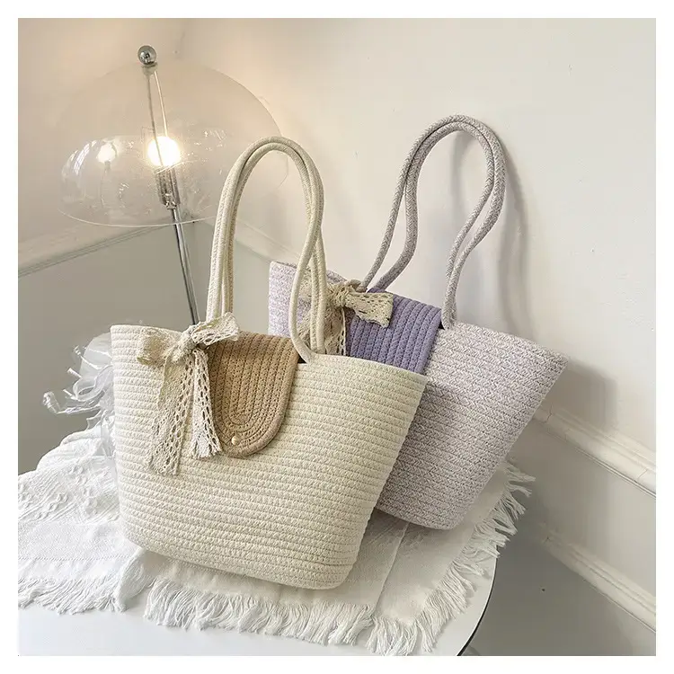 Women's woven straw tote bag with purple accent — feature 23