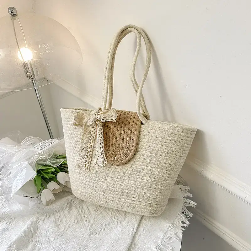 Women's woven straw tote bag with purple accent