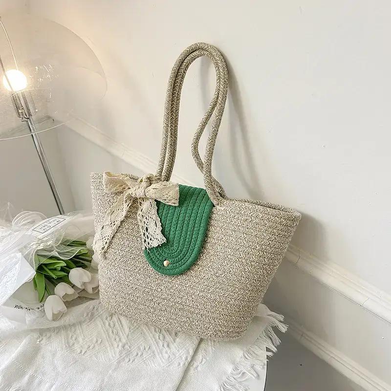 Women's woven straw tote bag with purple accent