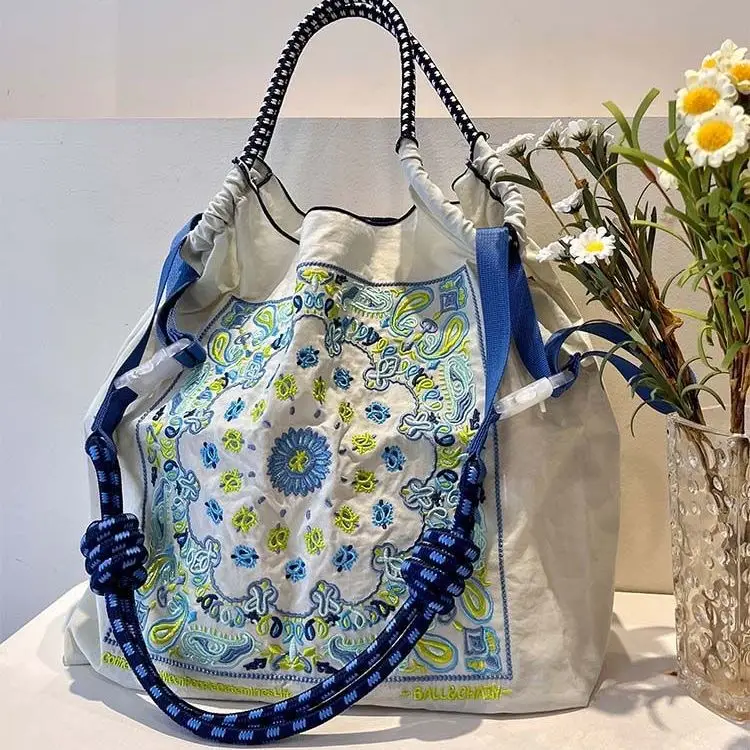 Japanese Style Embroidered Shoulder Bag with Blue Floral Design - Image 8