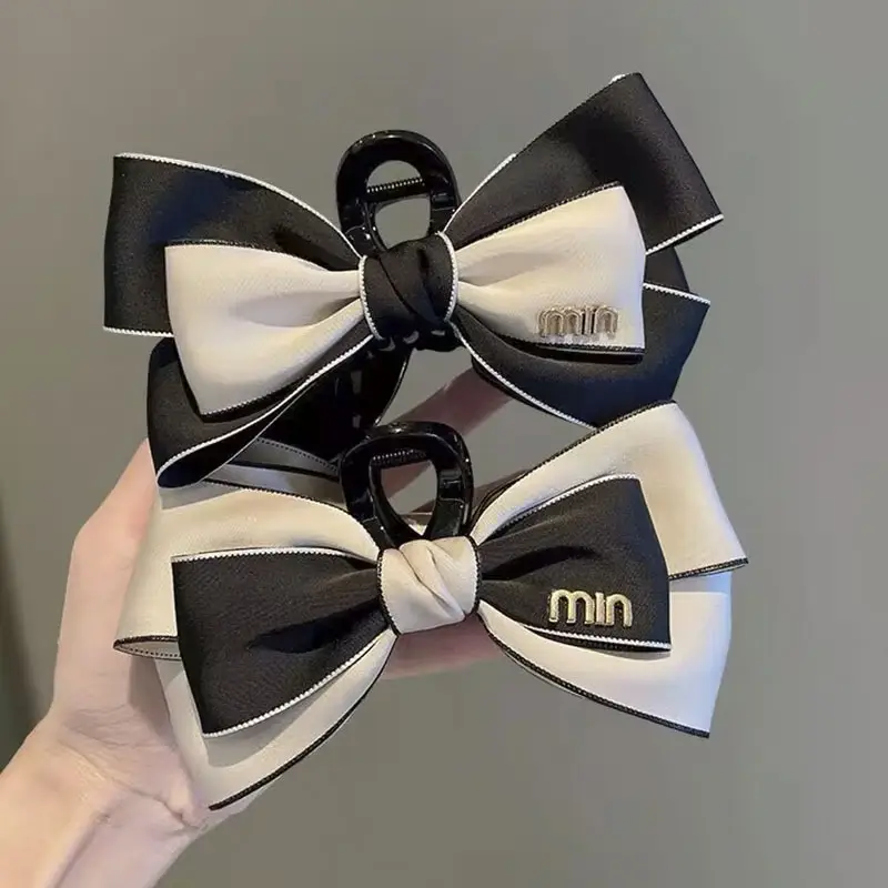 Oversized Black Silk Hair Clip with Pearl Accent — feature 22