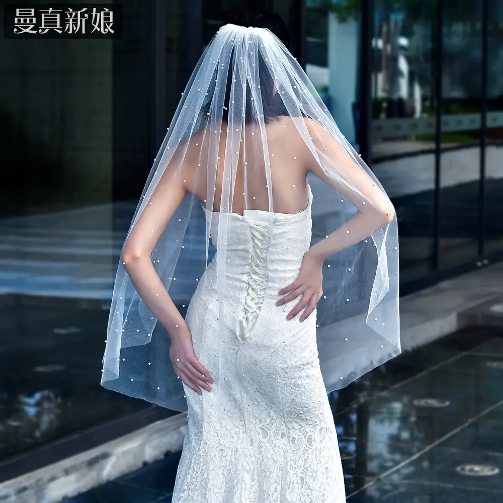 White Beaded Bridal Veil with Hair Accessory - Image 3