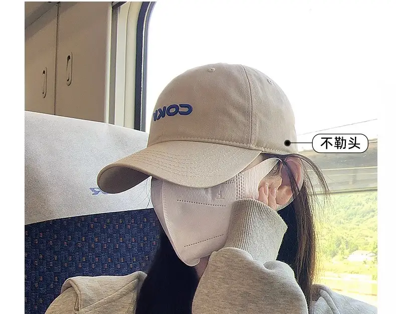 Beige Embroidered Baseball Cap with Face Design — feature 13