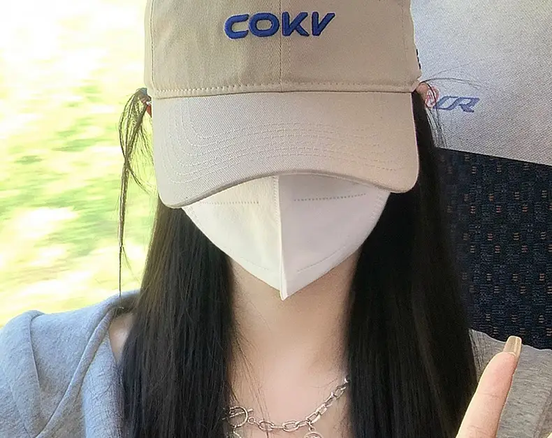 Beige Embroidered Baseball Cap with Face Design — feature 15